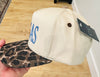 TEXAS Puff Embroidery in Dusty Blue on a natural and leopard hat