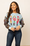 Nutcrackers on Blue Sweatshirt with Sequin Sleeves