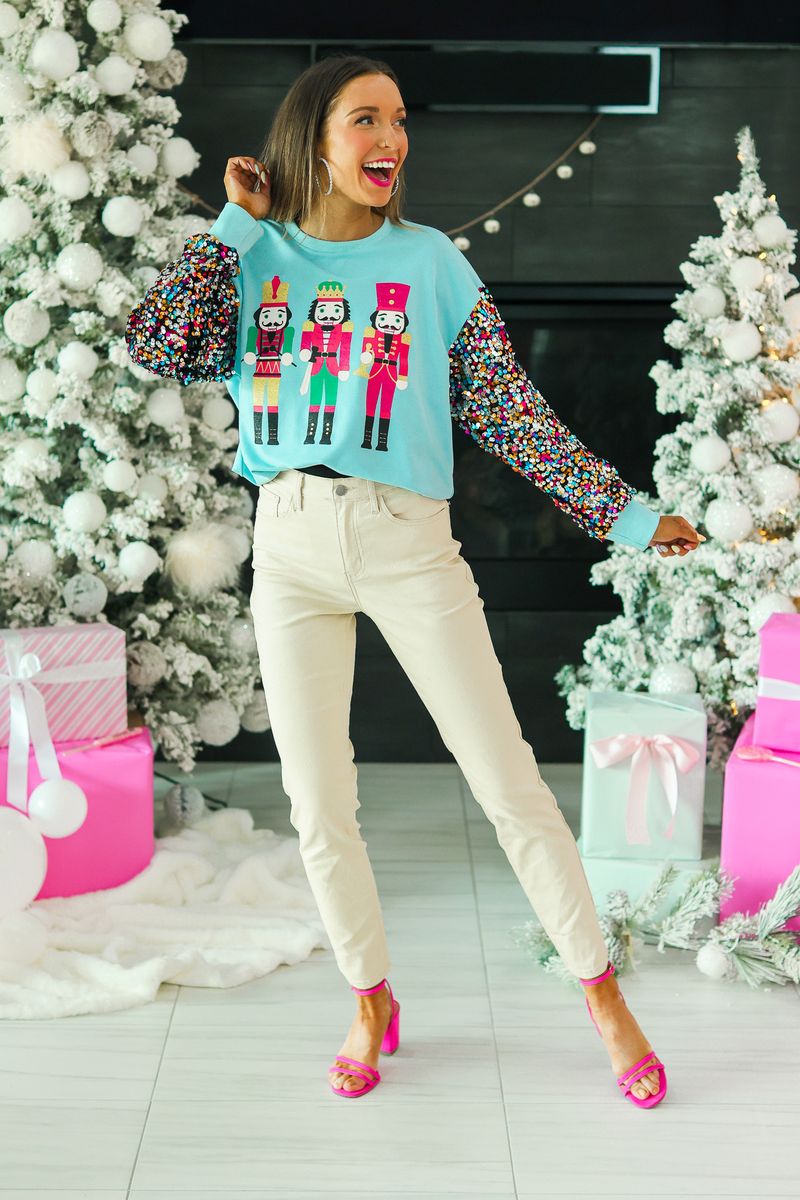 Nutcrackers on Blue Sweatshirt with Sequin Sleeves