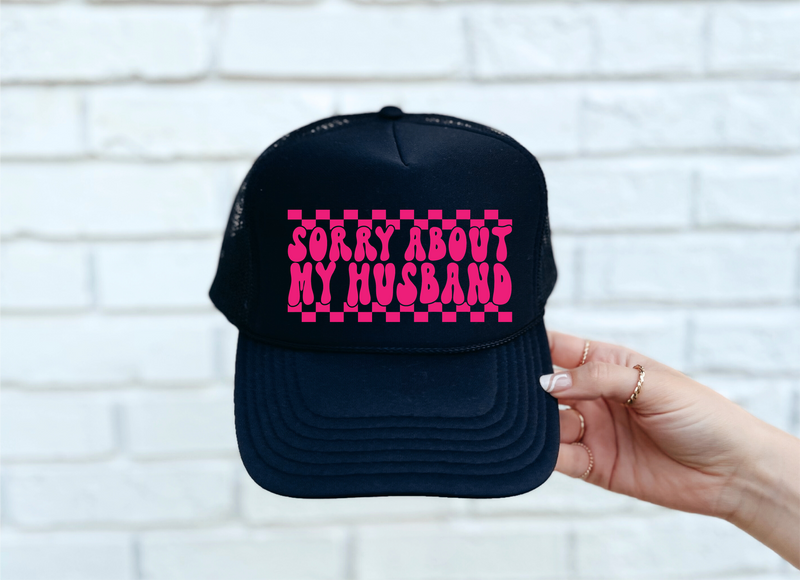 Sorry About My Husband DTF Printed Black Trucker Hat/Pink Text